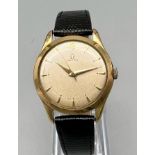 A Vintage Omega 1940s 14K Gold Gents Watch. Black leather strap. 14k gold case - 33mm. Mechanical