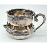 An Interesting Antique 800 Silver Tea Strainer and Serving Pot. Swivel design with one handle. 4.5cm