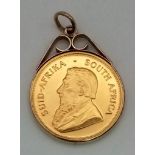 A 1981 22k Gold Krugerrand 1oz Coin in a 9K Gold Pendant Casing. Total weight - 37.56g. 33.9g of 22k