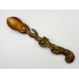 An interesting, antique, Oriental, heavily ornate, bronze tea spoon. Length: 19 cm, weight: 192 g.