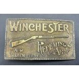 A Vintage 1970's Winchester Repeating Arms Rifle Gun Brass Belt Buckle, Length 9.5cm