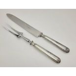 A VINTAGE ITALIAN SILVER HANDLED CARVING SET WITH 20cms BLADE. 296gms