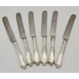 A SET OF 6 ART DECO PERIOD SILVER HANDLED KNIVES . 509.4grms