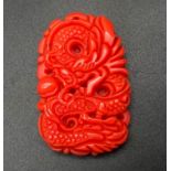 A Chinese Red Jade Dragon Pendant. 5cm