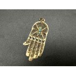 A 9K Yellow Gold and Turquoise Hand of God Pendant. 5cm. 2.97g.