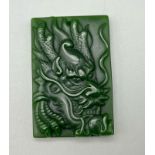 A Chinese Green Jade Dragon Pendant. 5.5 x 3.5cm.