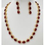 A Pear-Cut Ruby Gemstone Tennis Necklace (42cm) with a Halo of Diamonds in a Pave Setting. Set in