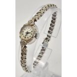 A Vintage 9K White Gold and Diamond Prelude Ladies Watch. 9k white gold and diamond chevron