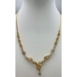 A very elegant 14 K yellow gold necklace with a beautiful design with diamonds (1.40 carats),
