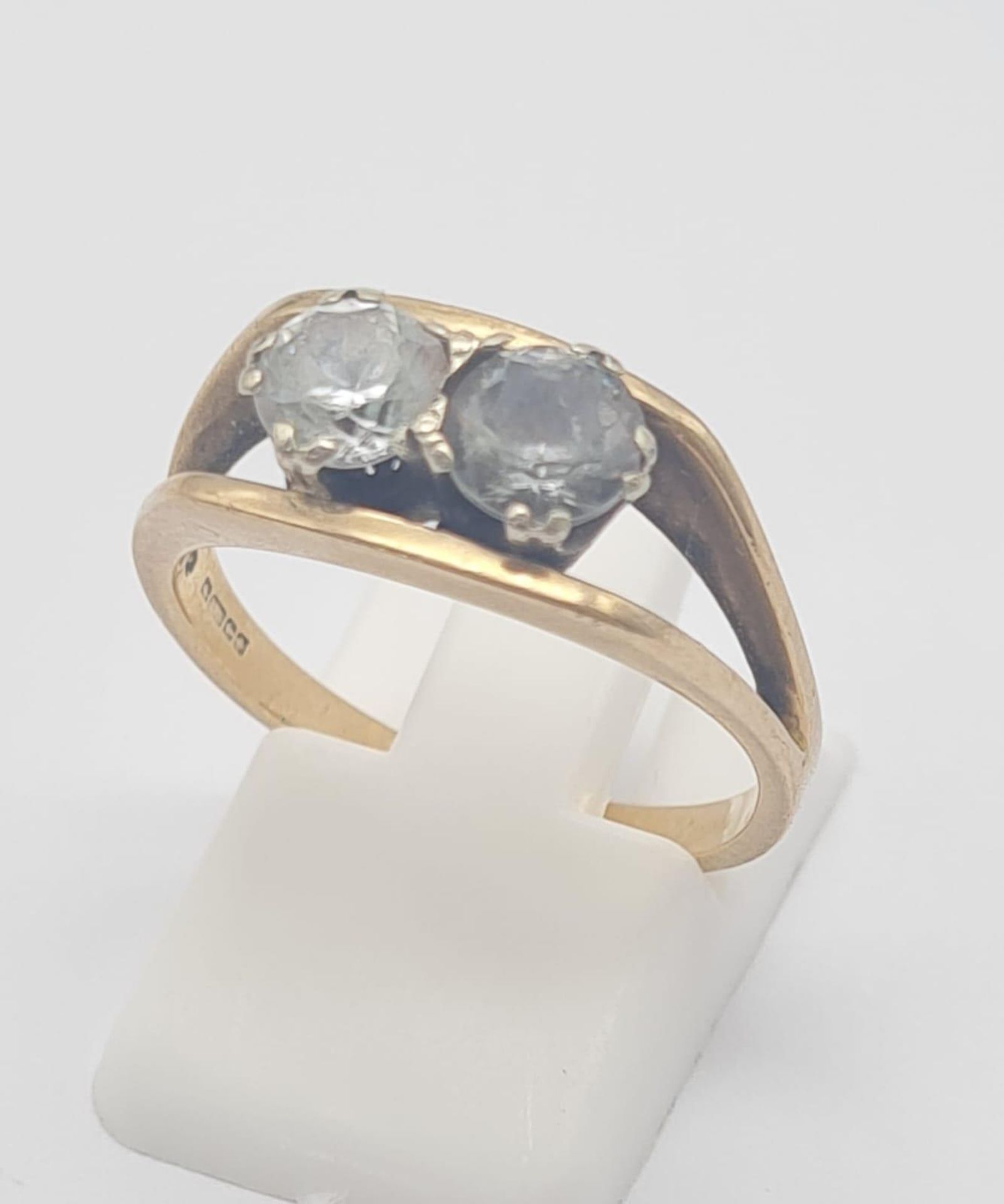 A Vintage 9K Yellow Gold Two Stone Ring. White and grey stone. Size P. 3.6g total weight.