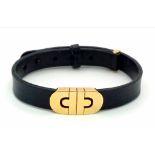 A Bulgari Perentesi 18K Gold and Black Leather Bracelet. Comes in a Bulgari presentation case (