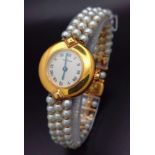 A very feminine CARTIER COLISEE watch. 18 K yellow gold, with a quality genuine pearl strap and a
