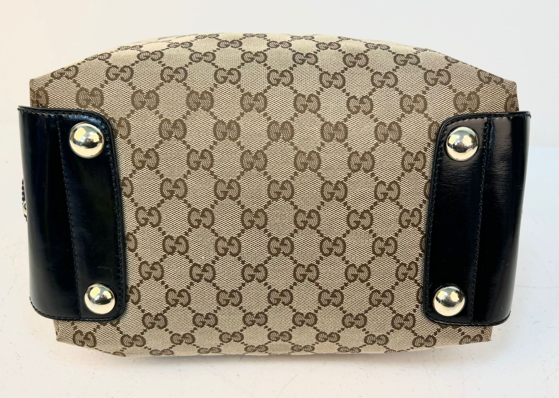 A Gucci Abbey Handbag. Monogram beige cotton exterior with black leather trim. Gucci logo black disc - Image 3 of 7