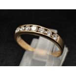 An 18K Yellow Gold Diamond Half-Eternity Ring. 0.70ctw. Size O. 3g total weight.