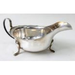 A 1935 Sterling Silver Gravy Boat. Hallmarks for Sheffield. Makers mark for Emile Viner. 6cm tall.