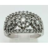 A 14K White Gold Diamond Three Flower Cluster Ring. 0.8ct approx. Size N. 6.61g