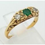A Vintage 18K Yellow Gold Emerald and Diamond Ring. Size H. 2.5g total weight.