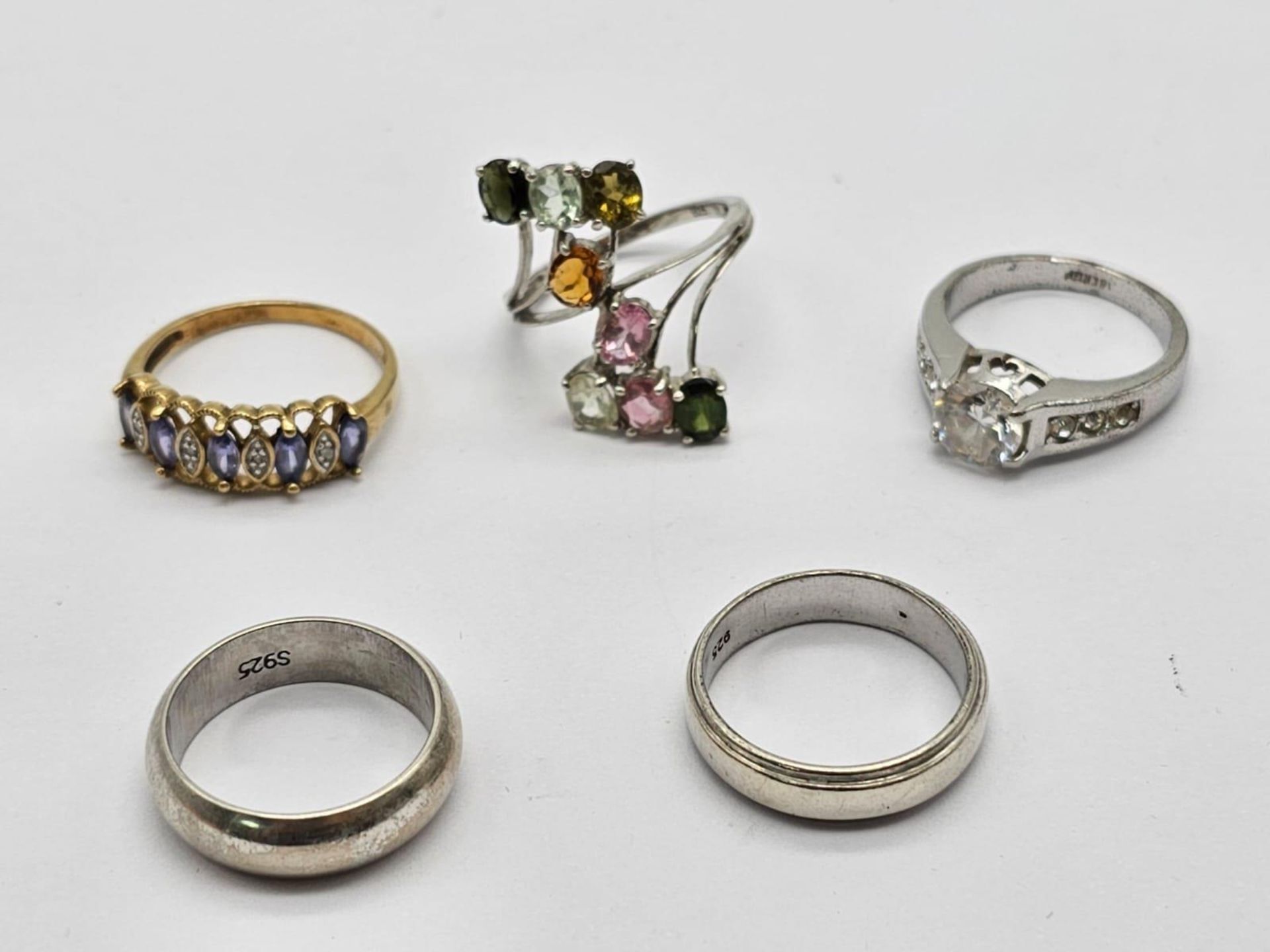 Five 925 Silver Rings. Three with brightly coloured stones and two band. 2 x N, 2 x O, 1 x P.