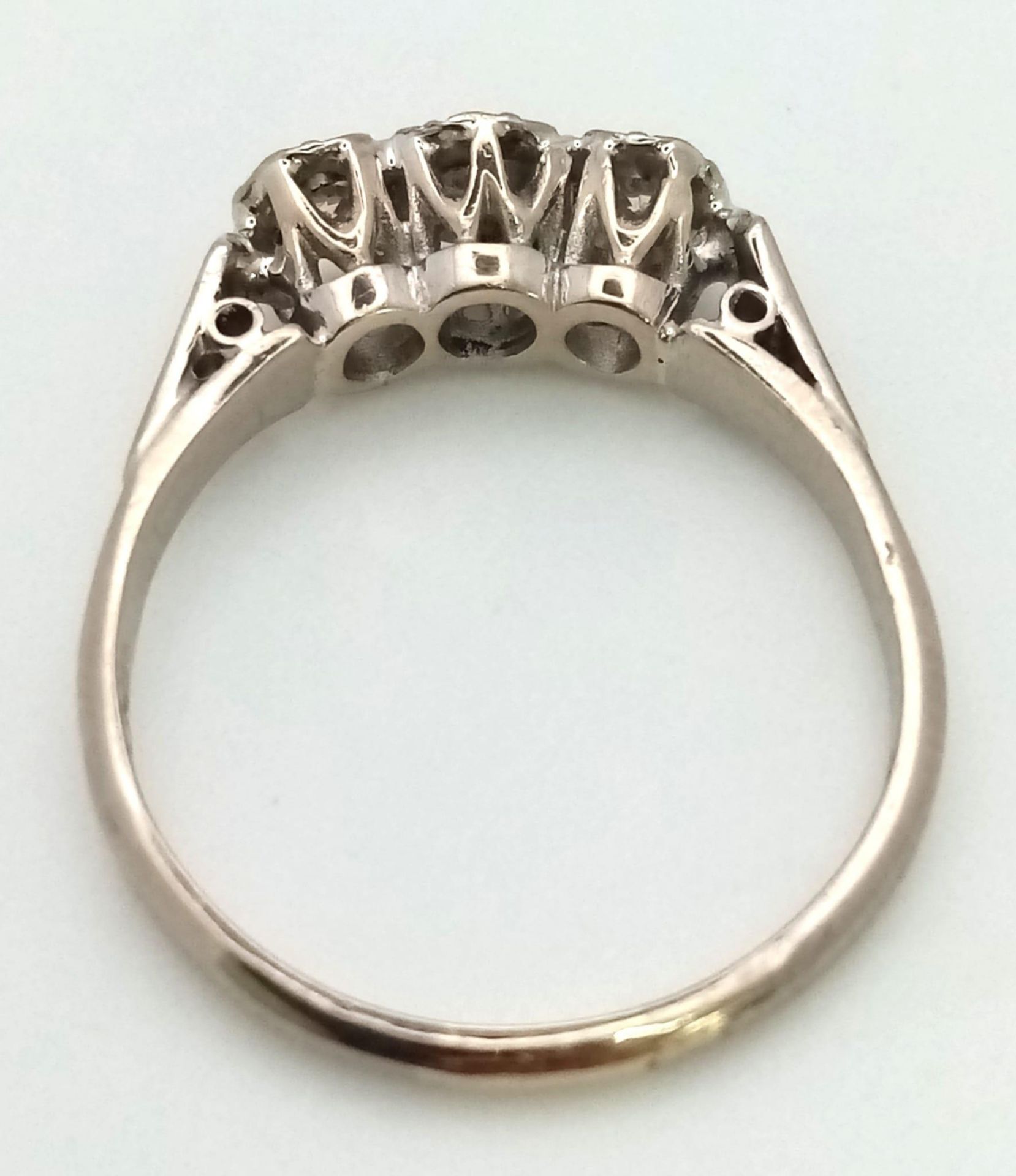 An 18K White Gold Three Stone Diamond Ring. Size N. 3.05g total weight. - Image 3 of 4