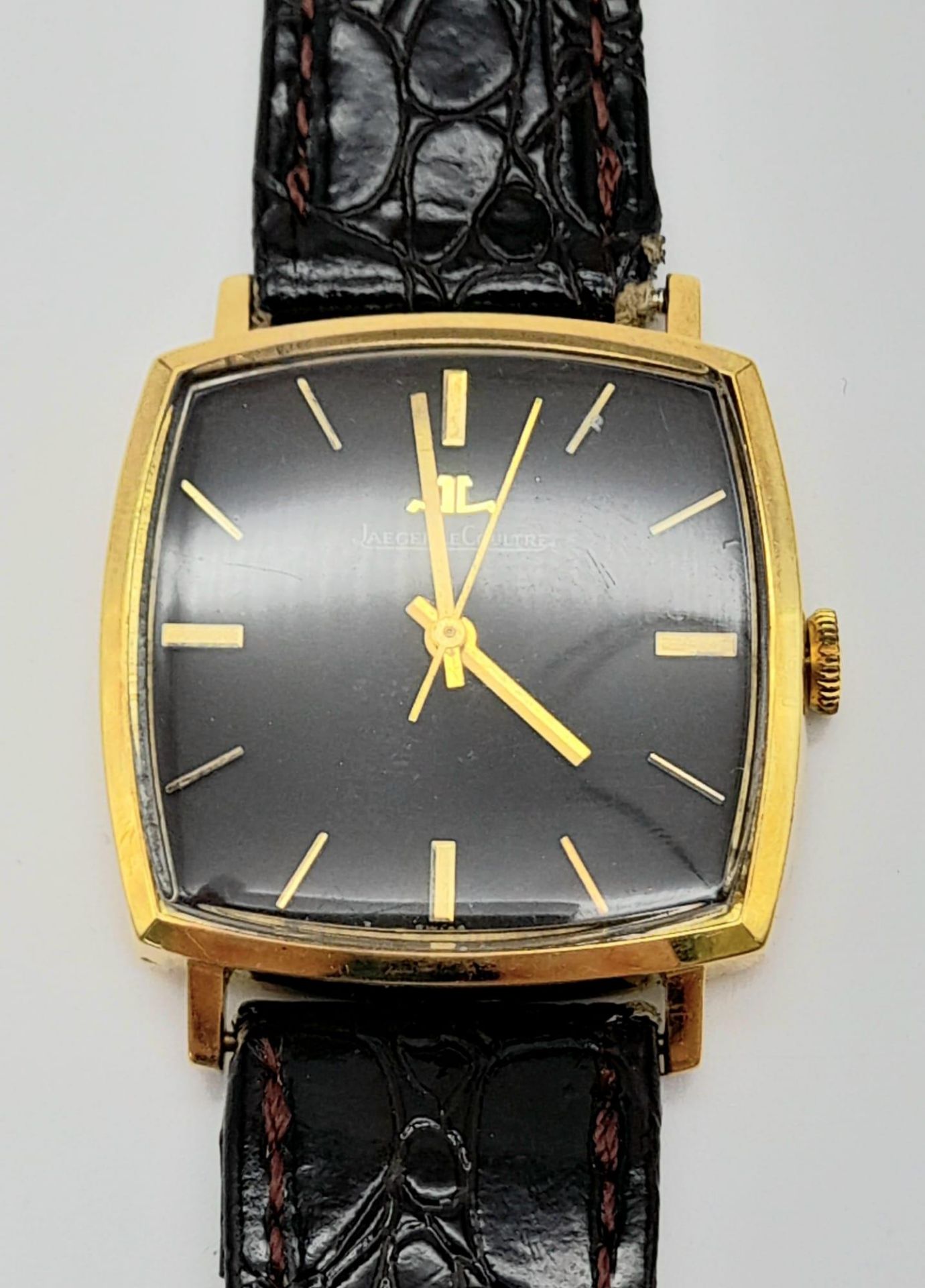 A vintage, Jaeger-Le Coultre 18 K gold plated watch. Case 31 x 31 mm, chocolate coloured dial with