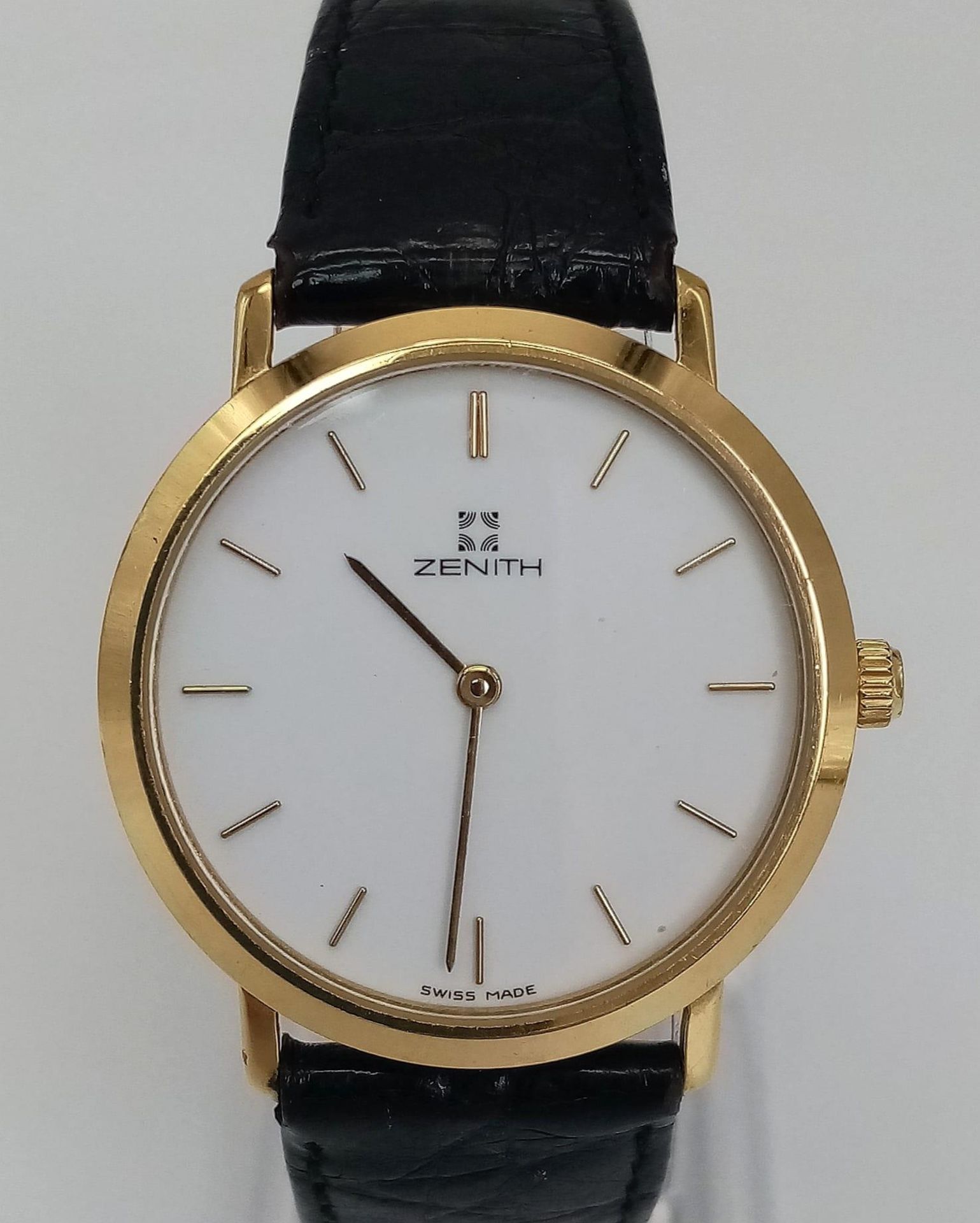 A Vintage Zenith Mechanical Gents Watch. Black leather strap. Two-tone case - 33mm. White