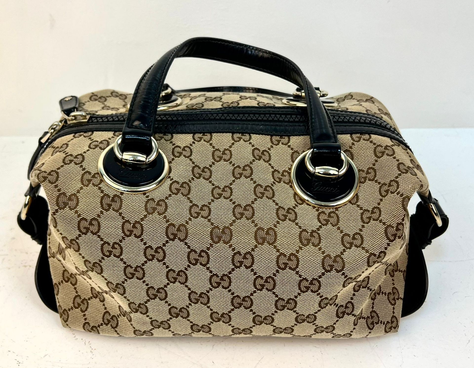 A Gucci Abbey Handbag. Monogram beige cotton exterior with black leather trim. Gucci logo black disc - Image 2 of 7