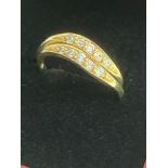 Pair of matching 14 carat GOLD RINGS worn together in interlocking style. Sparkling clear