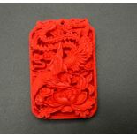 A Red Chinese Cinnabar Dragon Pendant. 5.5 x 3.5cm