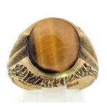 A Vintage Tigers Eye 9K Yellow Gold Ring. Tigers eye cabochon with bark effect decoration. Size S.