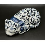 A Chinese, hand painted, Blue and white porcelain cat, with a Qianlong (1736-1796) red seal at