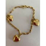 14 carat GOLD fancy link BRACELET, mounted with 14 carat GOLD HEARTS. 5.5 grams. 19 cm.