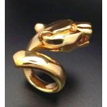 A statement 18 K yellow gold ring in the shape of a Panther twisted round the finger. Size: M,