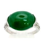 An 18K White Gold Jade and Diamond Ring. Green Jade cabochon with diamond shoulders. Size M. 4g