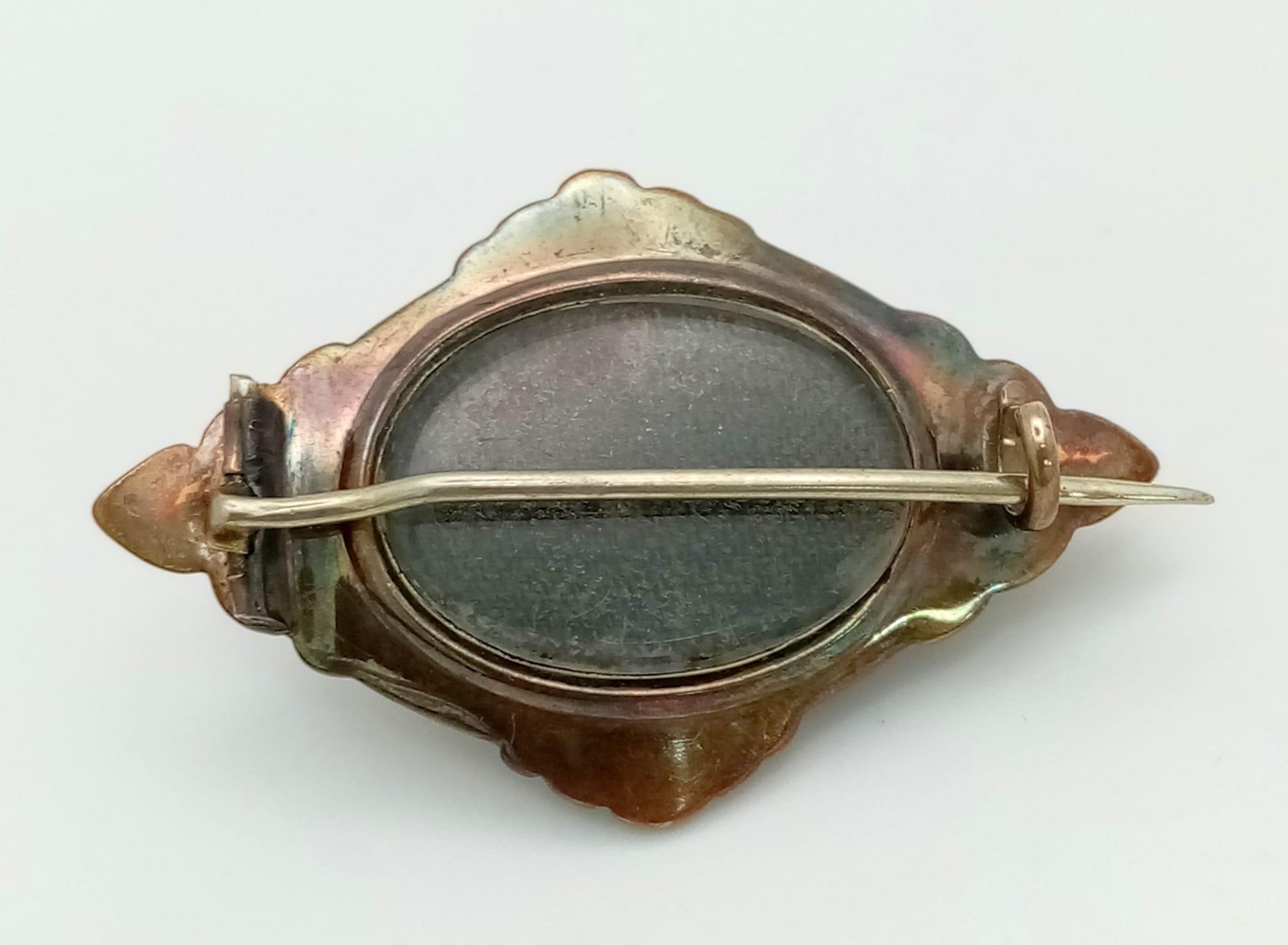 An Antique Victorian Mid Karat Rose Gold Mourning Brooch. Central oval garnet with memento capsule - Image 3 of 3