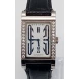 A Bulgari Rettangolo 18K White Gold and Diamond Dress Watch. Black Leather strap. 18K Gold tank case