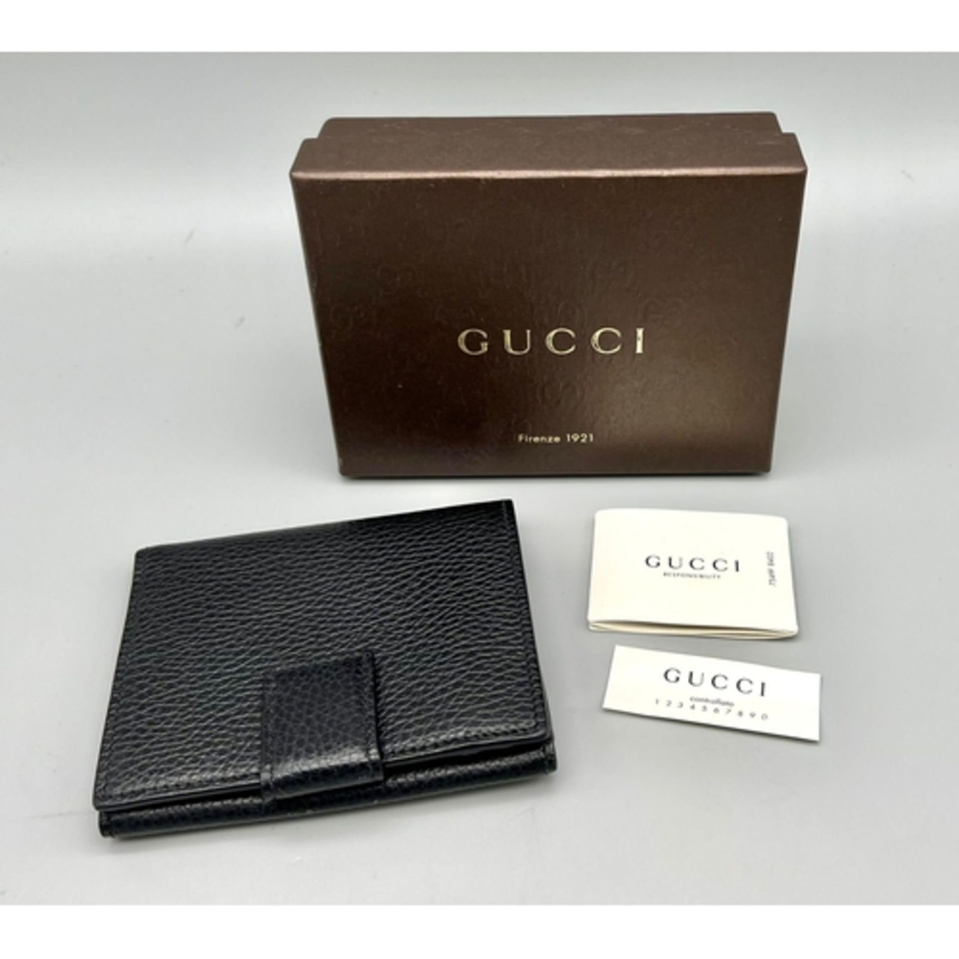 A Gucci Blue Leather Textured Wallet. Clip open exterior pocket plus plenty of inner card space.