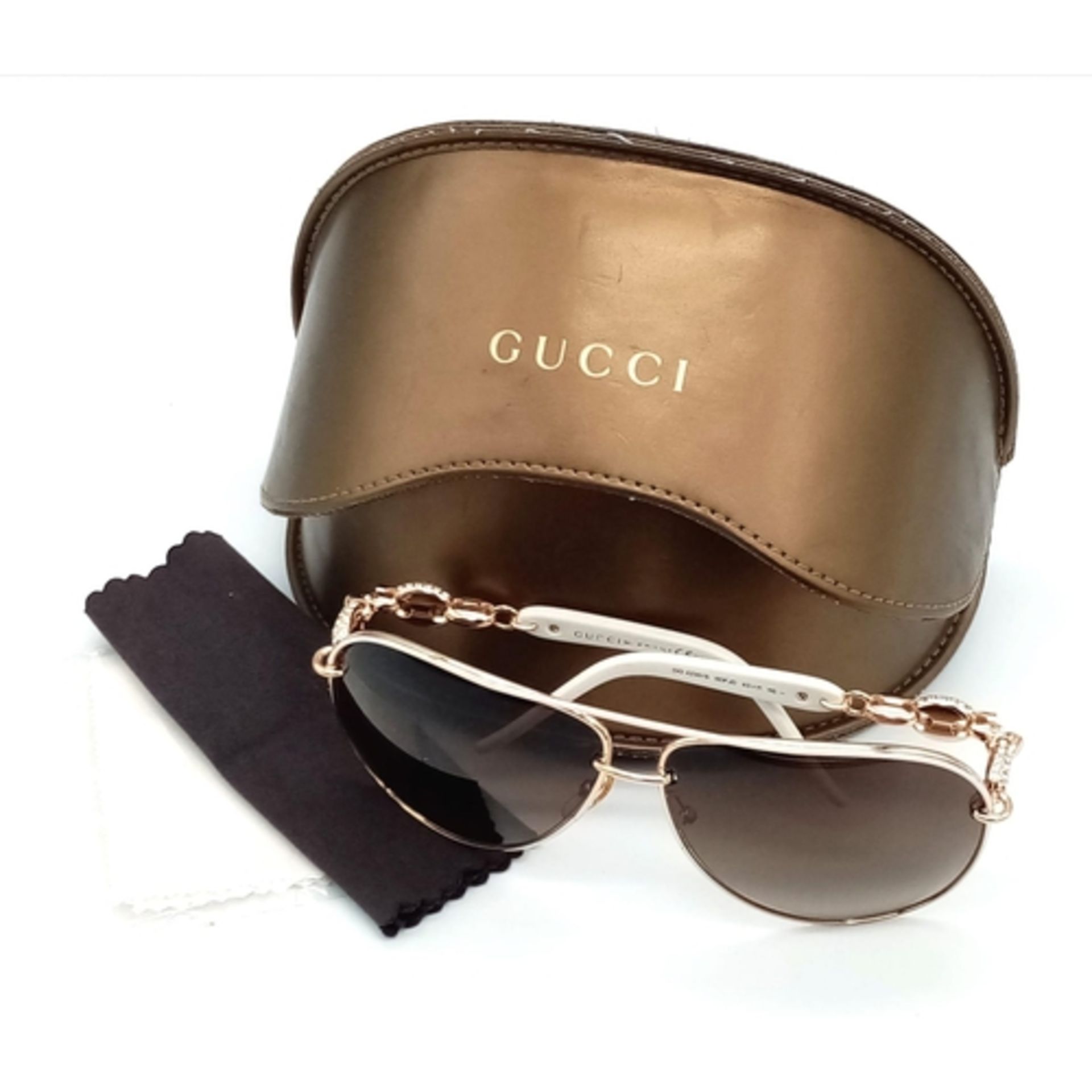 A Pair of Gucci Ladies Sunglasses and Gucci Case. Ref: 12751. Missing a nose pad.