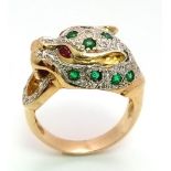 An 18 k yellow gold Panther ring with diamonds and emeralds and two ruby eyes. Ring size: K, weight: