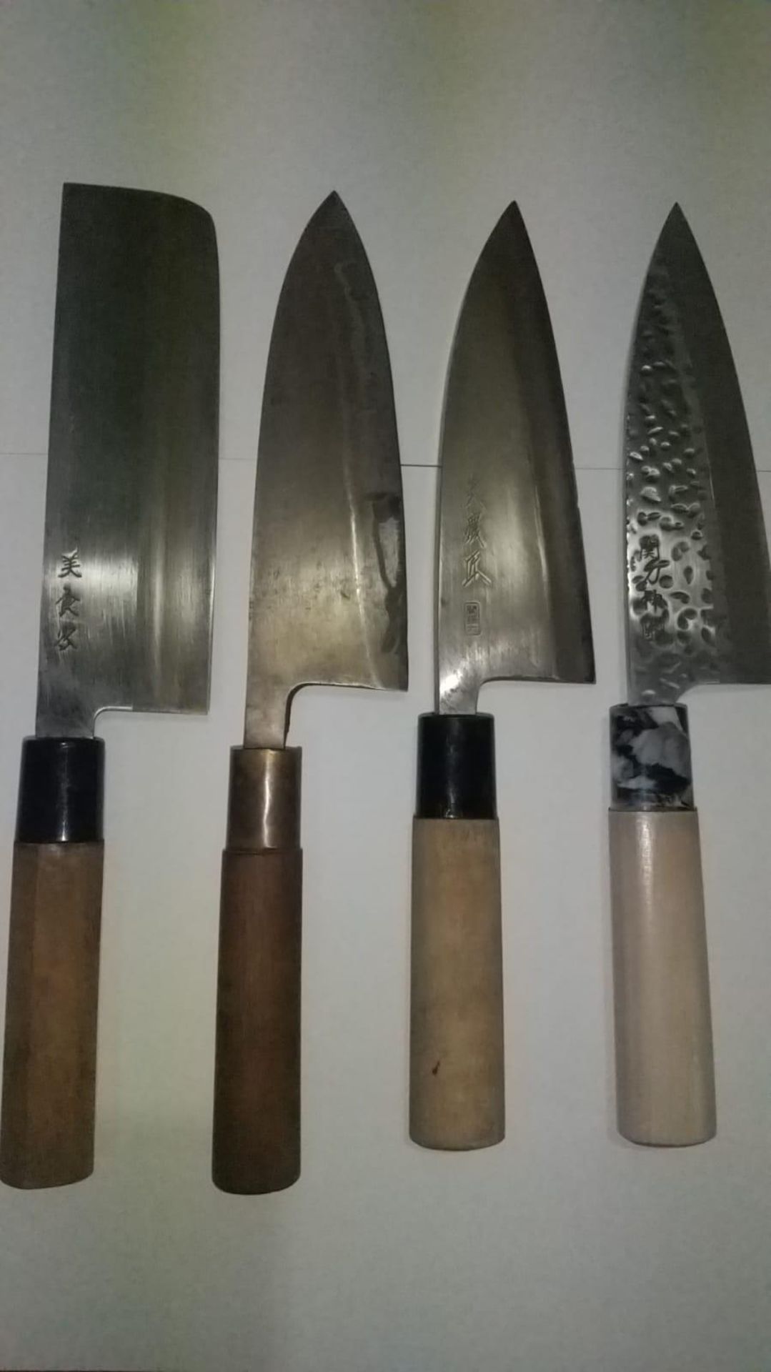 Japanese Chefs knifes set. Four Japanese hand forged Chefs knifes from right signed. SEKI TOSHIN,