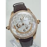 A Girard-Perregaux Financial World Time 18K Rose Gold Gents Watch. Brown leather strap with 18k rose