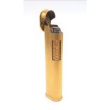 A DUNHILL GOLD PLATED FLIP TOP LIGHTER IN VERY GOOD CONDITION . 7cms tall. No International shipping