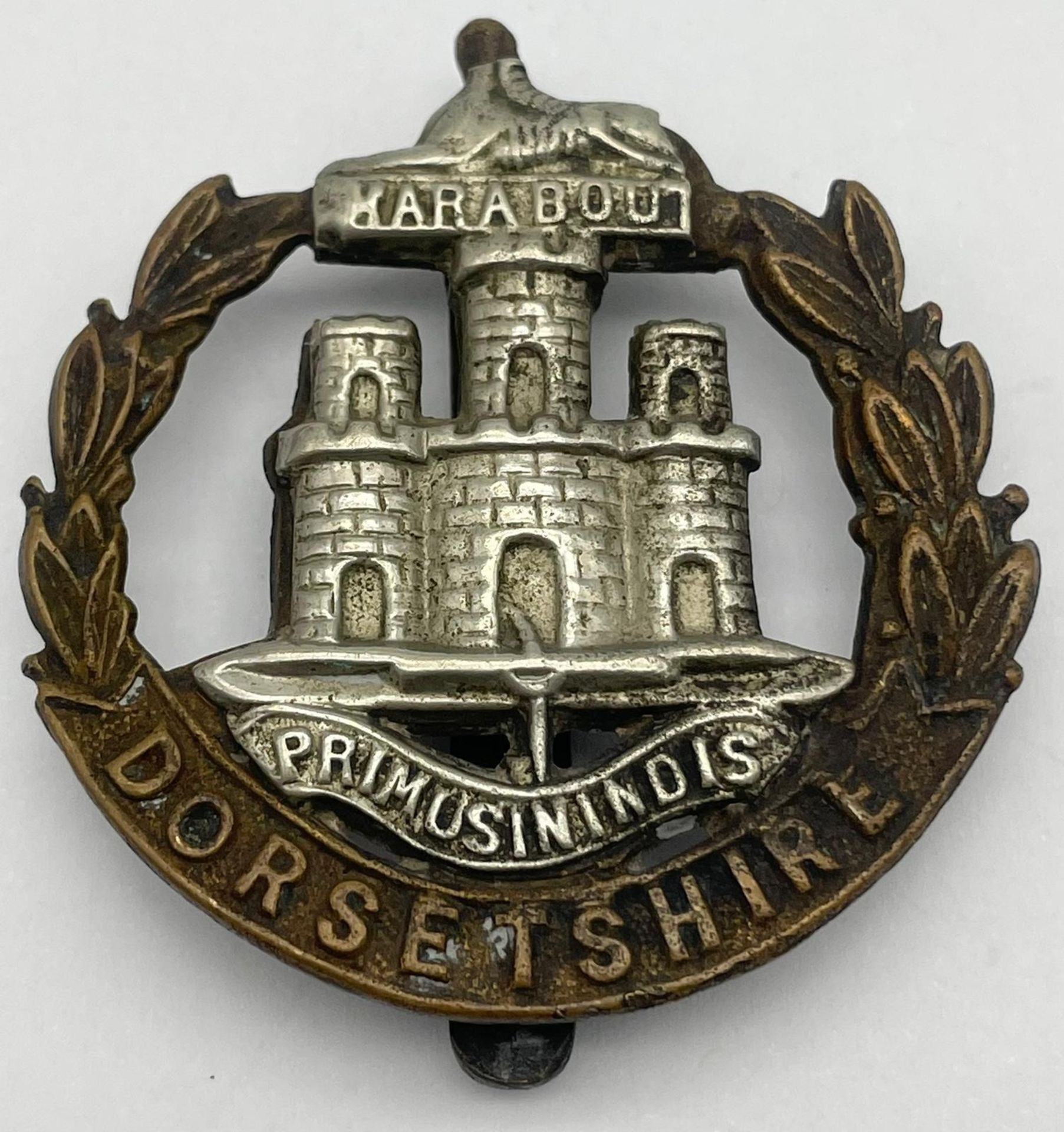 Three British Military Cap Badges: WW1 Dorsetshire Regiment Corp, WW2 Royal Artillery Manchester and - Image 6 of 6