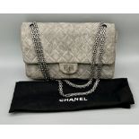 A Classic Chanel Grey Suede Quilted Large Shoulder Flap Bag. Quilted soft suede exterior (worn).