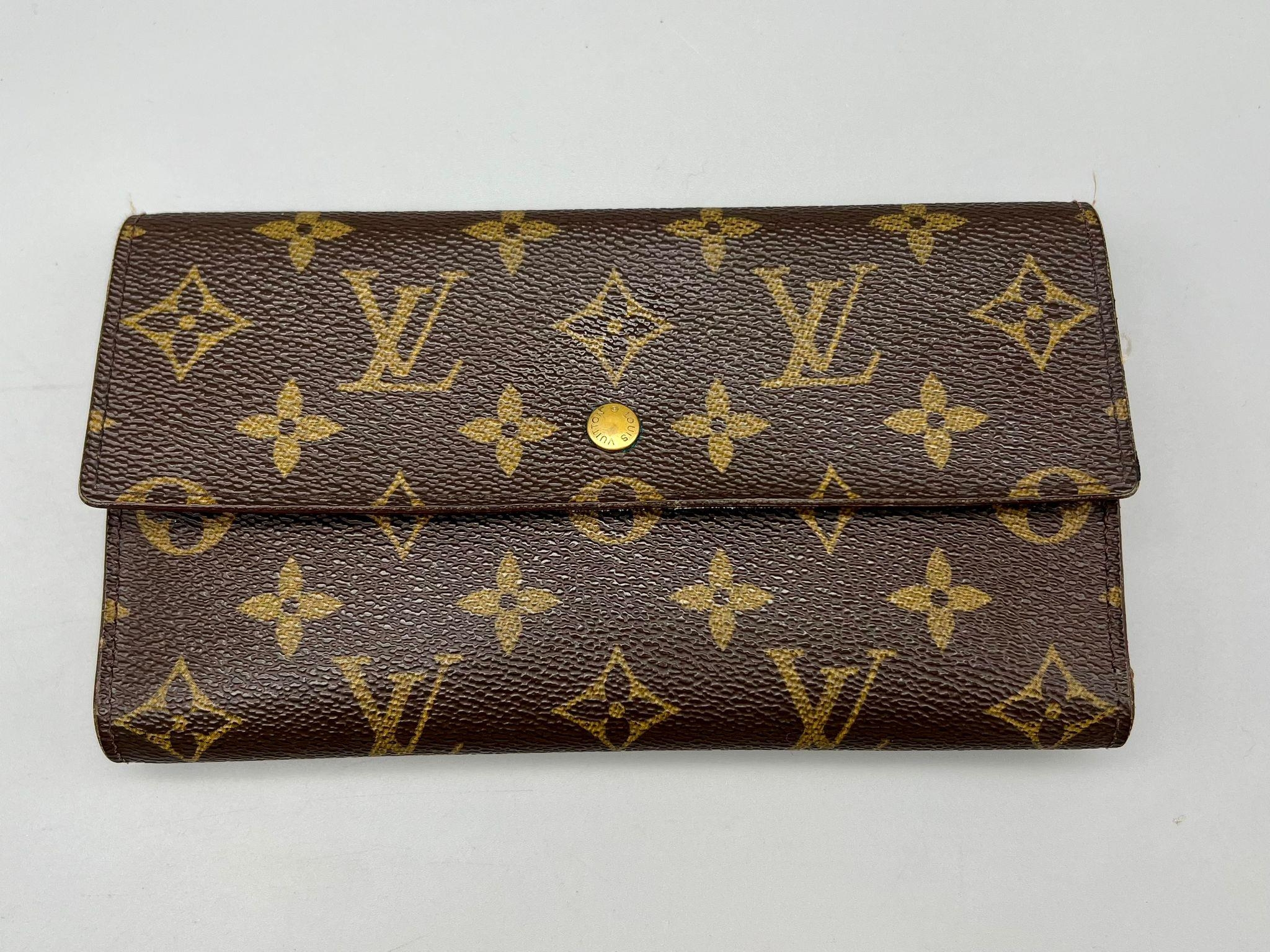 A Louis Vuitton Monogram Canvas Wallet. 19cm x 10cm. Please see photos for conditions. Ref: 12764