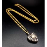 A Vintage Diamond and Pearl Heart Pendant Set in Rose Gold on an Italian 9K Yellow Gold Figaro