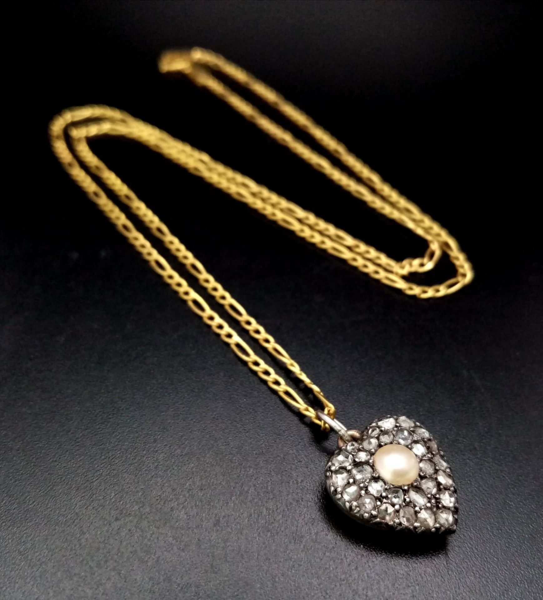 A Vintage Diamond and Pearl Heart Pendant Set in Rose Gold on an Italian 9K Yellow Gold Figaro