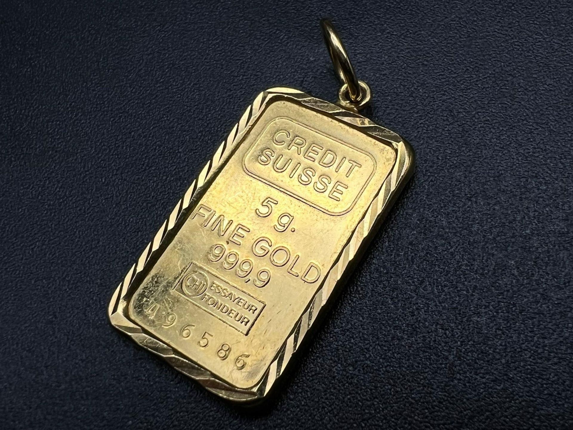 A 5g Fine Gold (.999.9) Pendant - Frame set in 14k Gold. Total weight - 5.9g.
