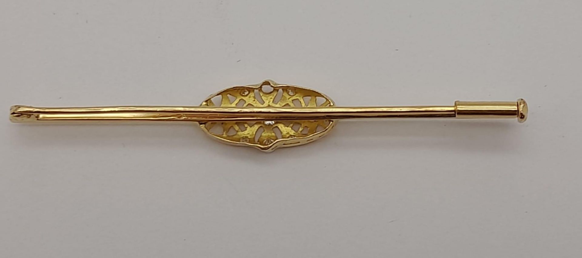 AN ANTIQUE 18K GOLD AND DIAMOND BAR BROOCH IN ART DECO STYLE . 4.7gms - Image 2 of 3