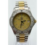 A Tag Heuer 2000 Professional 200m, Swiss Made, Stainless Steel Bracelet Watch. Gold Tone, Yellow