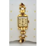 A Vintage Tudor (Rolex) Ladies Watch. Gold plated bracelet. Small rectangular case - 16 x 22mm.